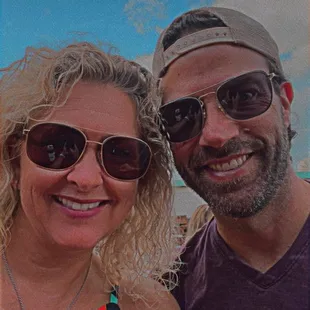 a man and a woman in sunglasses