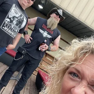 a man with a beard and a woman with a beer