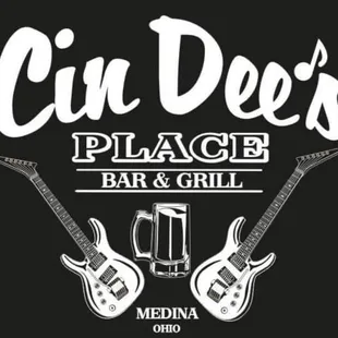 two guitars and a mug of beer