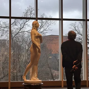 One of the statues in the Cincinnati area, by an outside window.