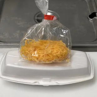 Cincinnati Chili Company cheese coney to go.