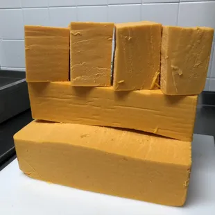 Cincinnati Chili Company blocks of Wisconsin cheddar cheese.