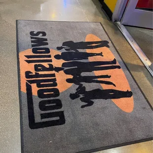 a doormat with a group of people on it
