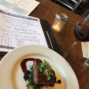 Starter pork belly and sauted Spinach with red Pinot