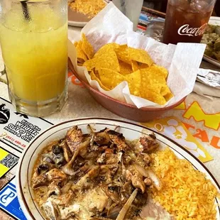 Pollo ala crema added rice and beans and a large house margarita