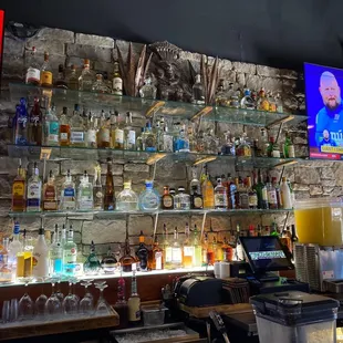 a bar with a television on the wall