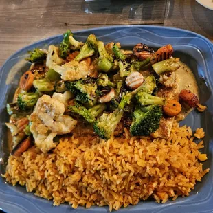 a plate of rice and vegetables
