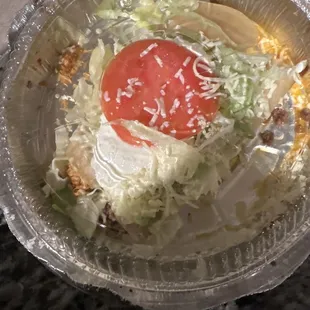 a salad in a plastic container