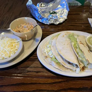 Fish tacos were really good. Come with a side of homemade creamy salsa and a refreshing (verde?) sauce.