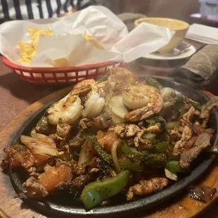 Steak, chicken and shrimp fajitas