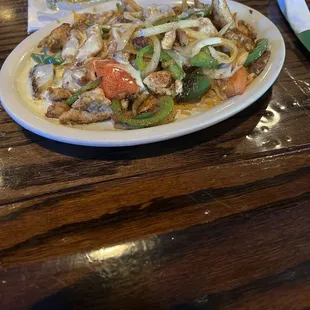 Pollo enquesado (lunch portion) and added fajita veggies (no extra charge).  Tasty, filling lunch for about $10.