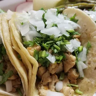 three tacos on a plate