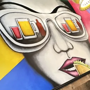 a woman with sunglasses and a taco