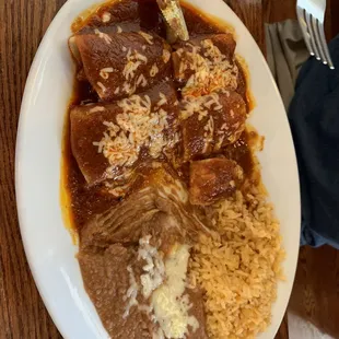 Enchiladas (pork, chicken, shrimp), rice and beans