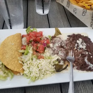 Combo picked 2. Hard beef taco, chille relleno, beans and pico salad