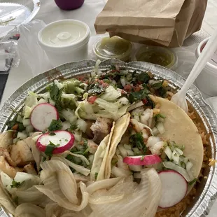 Three tacos: two fish and one shrimp