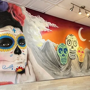 a woman with sugar skulls on her face