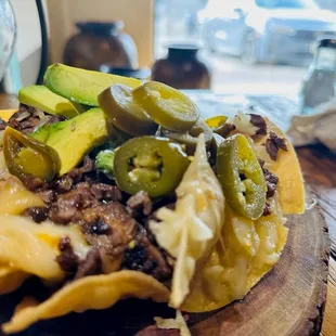 a plate of nachos on a table