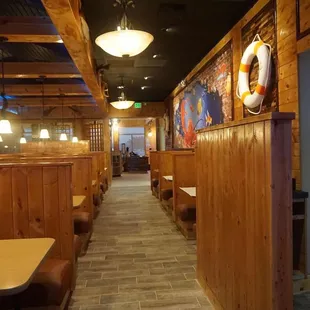 inside of a restaurant with wooden booths