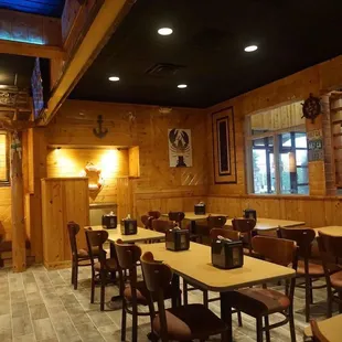 a dining room with tables and chairs