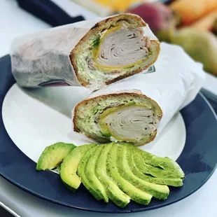 Turkey avocado ,  Turkey and lettuce and tomatoes and mayonnaise and avocado on hero