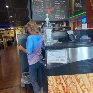 a woman standing at the counter