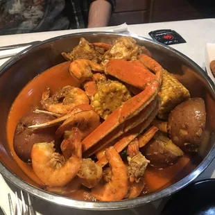 Seafood Boil- Combo - 1 lb snow crab legs, 1 lb headless shrimp, potatoes, corn with hush puppies.