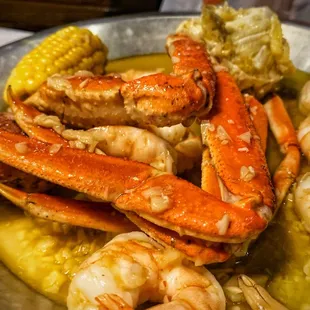 Snow crab legs and peeled shrimp in garlic butter.
