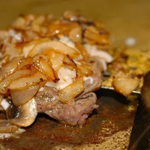 Rib eye steak burger with grilled onions and grilled mushrooms