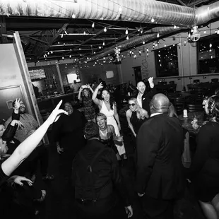 a group of people dancing at a party
