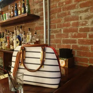 a purse on the bar