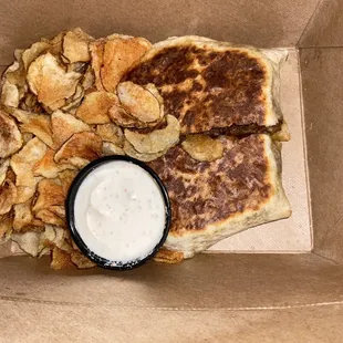 Crunch wrap with Aleppo sour cream and chips