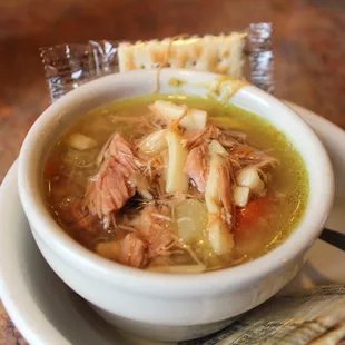 a bowl of soup and crackers
