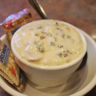 a bowl of soup and crackers