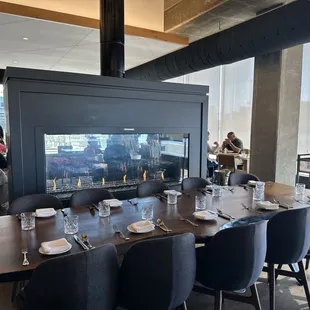 Fire place in center of the restaurant. Provides a cozy and comfortable experience.