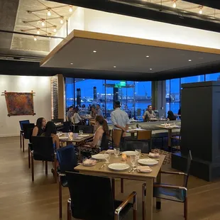 Interior and further in the back of photo is outdoor seating.