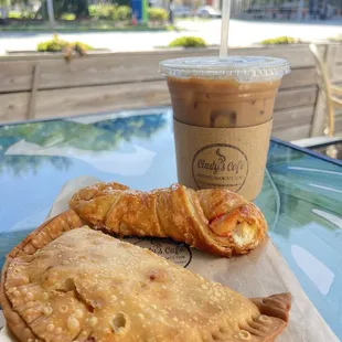 Chicken empanada, guava quesito, café con leche