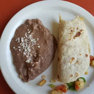 Papa a la Mexicana taco with refried beans