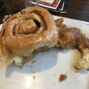 a cinnamon roll on a plate