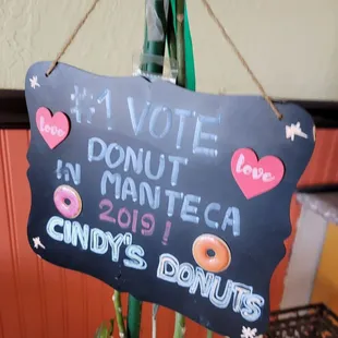 a sign for a donut shop