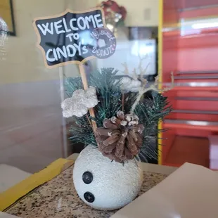 a welcome sign on a table