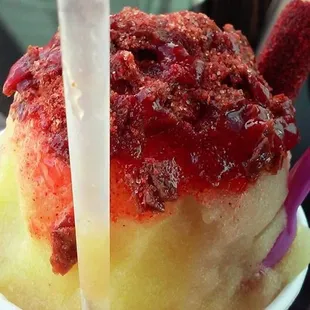 This is mango and tamarindo swirl with chamoy in the middle and mexjcan candy powde and more on the top!