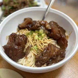 a bowl of noodles and meat