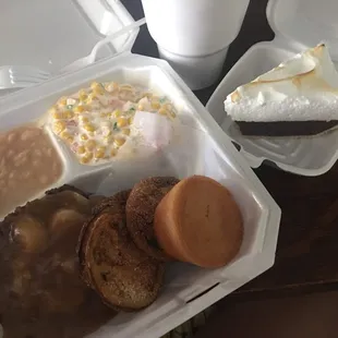 Hamburger steak with onions and gravy, fried green tomatoes, white beans, &amp; corn salad.  Cornbread and chocolate pie.