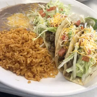 a plate of tacos and rice