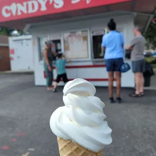 Vanilla soft serve on a waffle cone