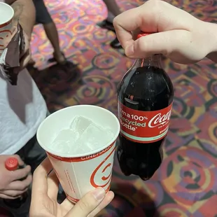 The small cup of ice and our warm bottle of Coke