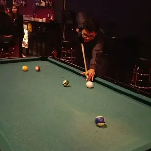 a man playing a game of pool