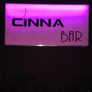 a neon sign for a bar
