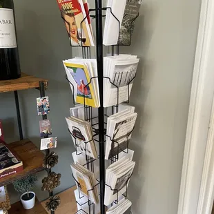 a wine rack with magazines
